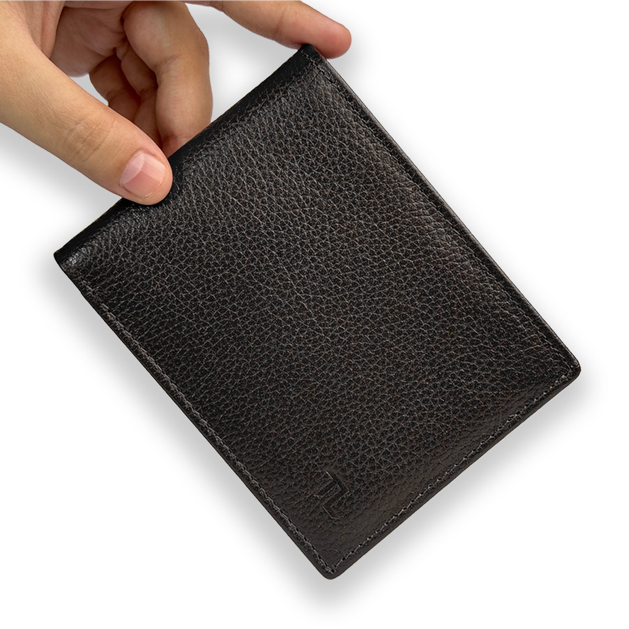 Black leather wallet held by a hand on a white background